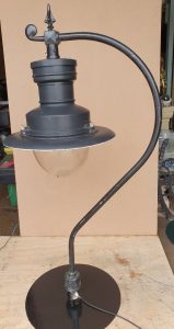 Reclaimed Suggs street light mounted on a cast iron swan neck bracket